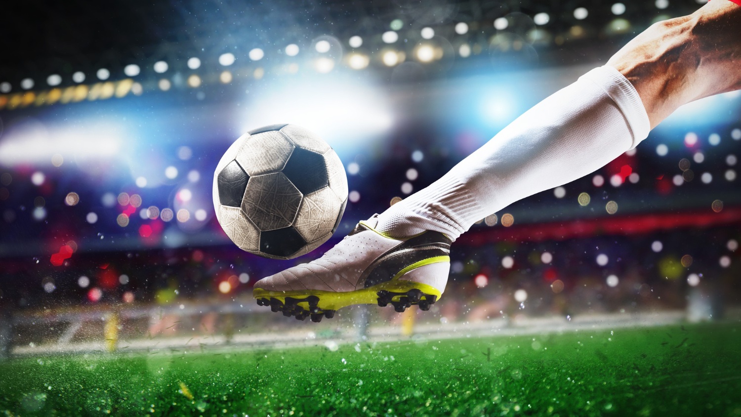football-scene-night-match-with-close-up-soccer-shoe-hitting-bal